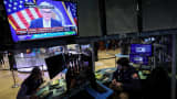 Traders react as Federal Reserve Chair Jerome Powell is seen delivering remarks on a screen, on the floor of the New York Stock Exchange (NYSE) in New York City, March 22, 2023.